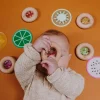 Hochet sensoriel bébé donut en bois pastèques