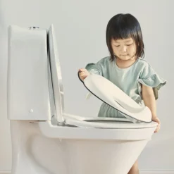Réducteur de toilette blanc et noir