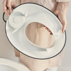 Réducteur de toilette blanc et noir