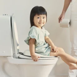 Réducteur de toilette blanc et noir