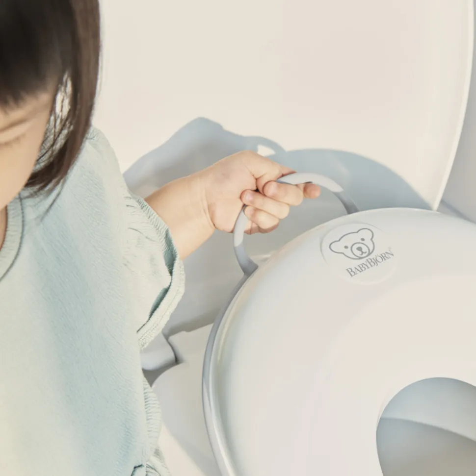Réducteur de toilette blanc et gris