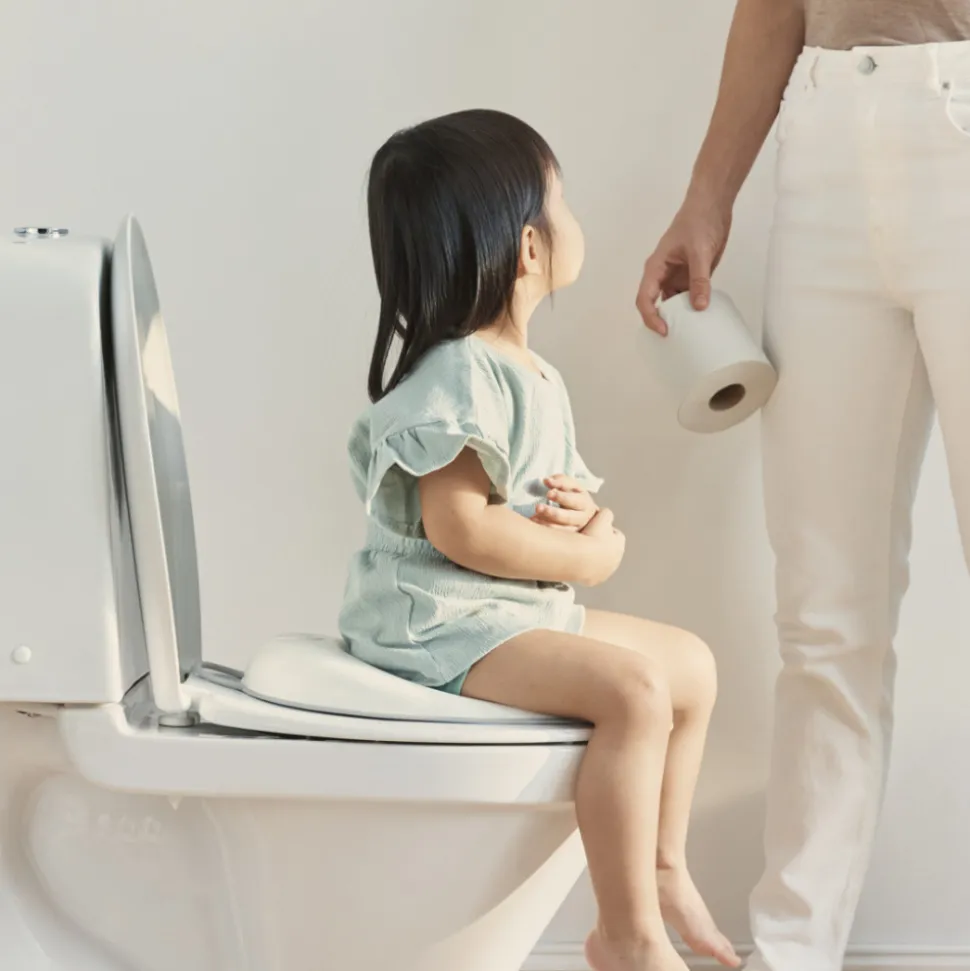 Réducteur de toilette blanc et gris
