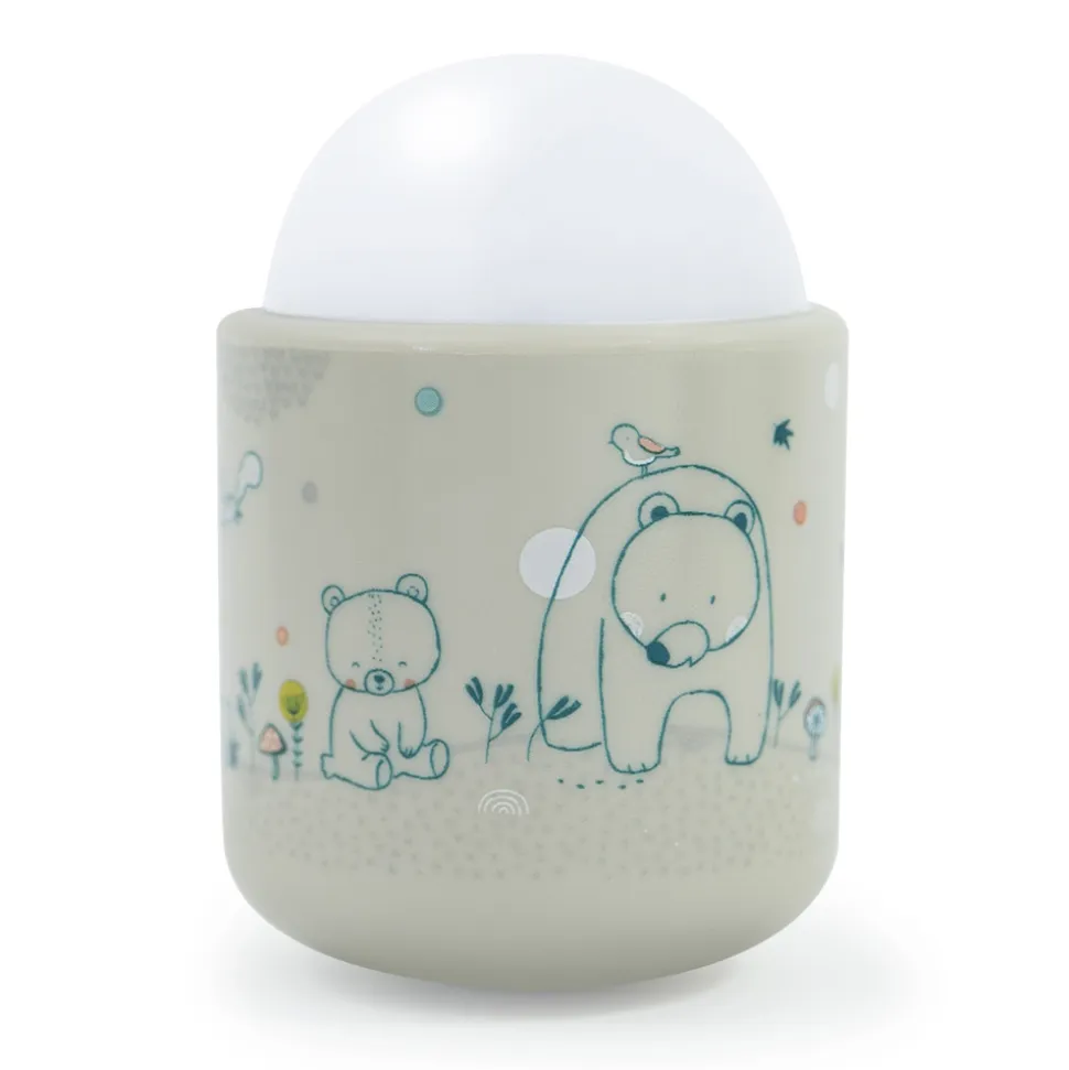 Veilleuse bébé nomade beige dans les bois